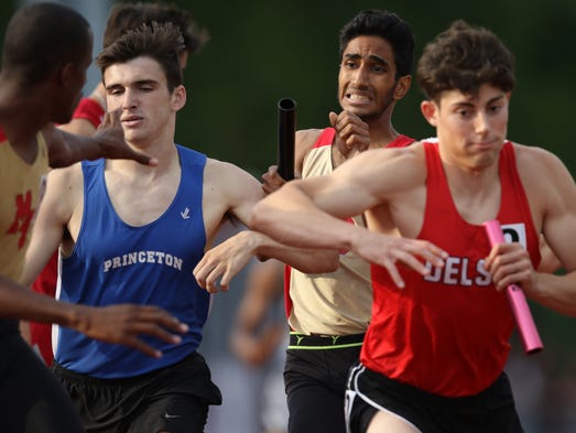 Jaymin Mistry, of Mount Olive tries to get the baton