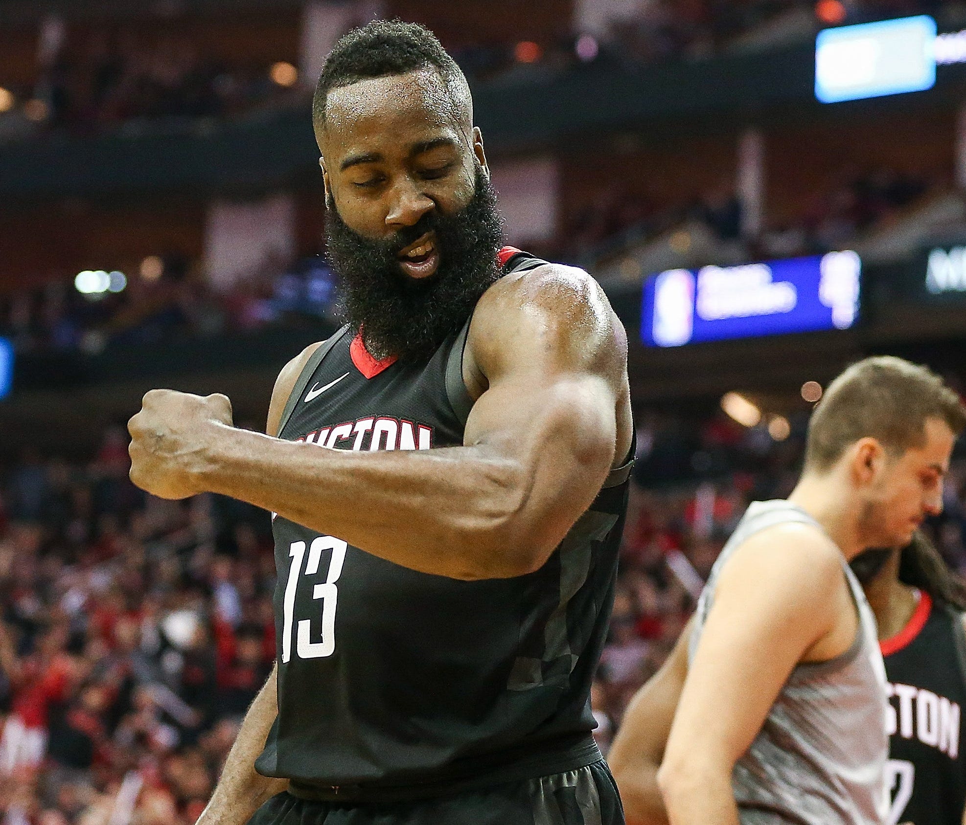 Houston Rockets guard James Harden reacts after scoring as Minnesota Timberwolves forward Nemanja Bjelica looks on during the third quarter in Game 1.