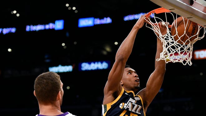 Donovan Mitchell dunks against the Lakers.