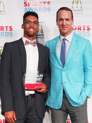 Peyton Manning poses with Times Area Baseball Player of the Year C.J. Willis of Ruston at the Sports Awards recently at the Shreveport Convention Center.