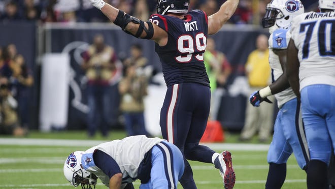 Texans defensive end J.J. Watt celebrates after sacking Titans quarterback Zach Mettenberger (7) during the third quarter of their game Nov. 1.