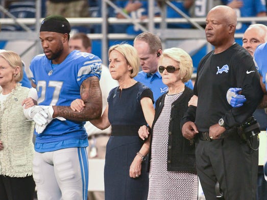 Lions owner Martha Firestone Ford stands with head