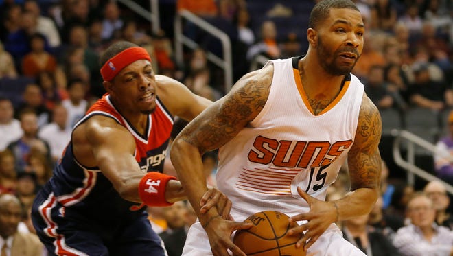 Suns forward Marcus Morris is fouled by Washington Wizards forward Paul Pierce during the first quarter at US Airways Center on January 28, 2015.