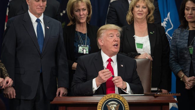 President Donald Trump speaks after signing an executive order to start the Mexico border wall project at the Department of Homeland Security facility in Washington, D.C., on Wednesday.