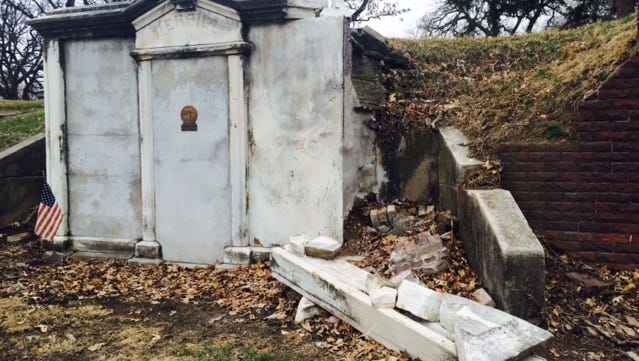 White marble has fallen from the front of former Gov. Samuel Merrill’s mausoleum at Woodland Cemetery in Des Moines.