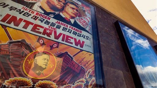A movie poster for the movie "The Interview" is displayed outside the AMC Glendora 12 movie theater  Wednesday, Dec. 17, 2014, in Glendora, Calif.