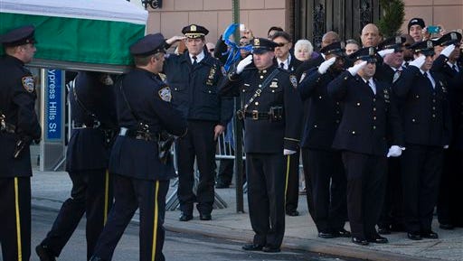 The casket of New York Police Department officer Rafael Ramos arrives to his wake at Christ Tabernacle Church in the Glendale section of Queens, where he was a member.