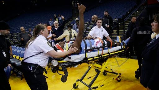 Denver Nuggets forward Kenneth Faried is taken off the court on a stretcher after an injury at the end of an NBA basketball game against the Golden State Warriors on Saturday, Jan. 2, 2016, in Oakland, Calif. (AP Photo/Marcio Jose Sanchez)