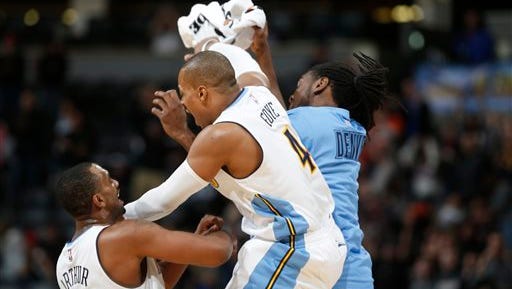 Denver Nuggets guard Randy Foye, center, celebrates hitting a three-point basket with teammates Darrll Arthur, left, and Kenneth Faried against the Indiana Pacers late in the second half of an NBA basketball game, Sunday, Jan. 17, 2016, in Denver. The Nuggets won 129-126. (AP Photo/David Zalubowski)