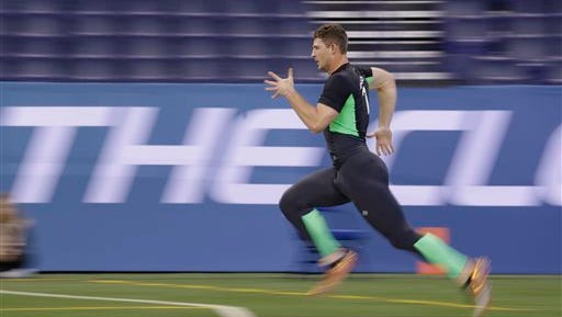Louisiana Tech quarterback Jeff Driskel runs the 40-yard dash at the NFL football scouting combine in Indianapolis on Saturday.
