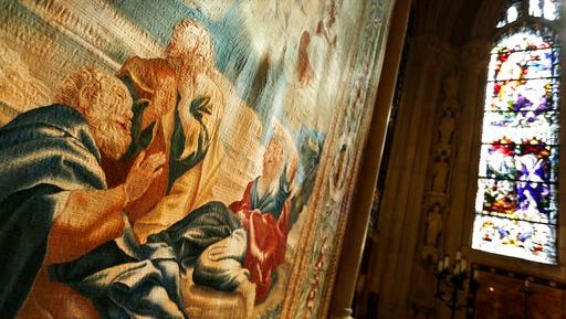 Recently preserved tapestries are displayed in an exhibit at the Cathedral of St. John the Divine in New York, Wednesday, March 22, 2017. Experts at the cathedral just spent 16 years sprucing up its super-size wall hangings with a labor-intensive process that uses dental probes, tweezers and other tools. Now the historic house of worship is inviting the public to enjoy the fruits of its labors. An exhibit called "The Barberini Tapestries, Scenes from the Life of Christ" runs through June 25.