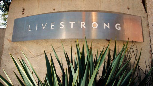 FILE - In this Jan. 13, 2013, file photo, a sign for the Livestrong Foundation is seen at the charity's headquarters in Austin, Texas. The Livestrong cancer charity continued its fundraising and contributions nosedive in 2015 for a third straight year after founder Lance Armstrong's performance-enhancing drug scandal, but foundation officials insist a rebound has already started.