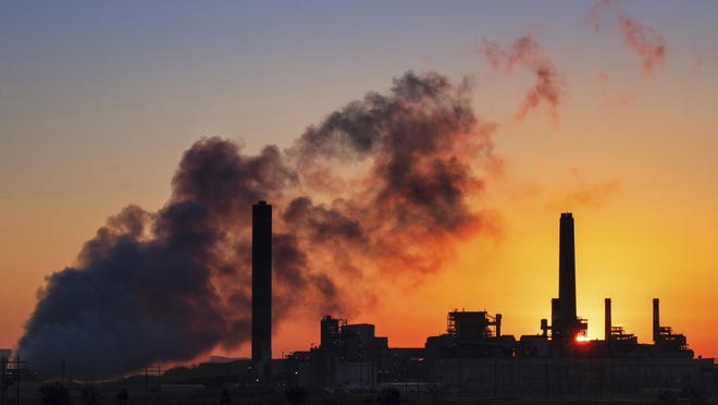 In this July 27, 2018, file photo, the Dave Johnson coal-fired power plant is silhouetted against the morning sun in Glenrock, Wyo. The Trump administration on Friday targeted an Obama-era regulation credited with helping dramatically reduce toxic mercury pollution from coal-fired power plants, saying the benefits to human health and the environment may not be worth the cost of the regulation. The 2011 Obama administration rule, called the Mercury and Air Toxics Standards, led to what electric utilities say was an $18 billion clean-up of mercury and other toxins from the smokestacks of coal-fired power plants.