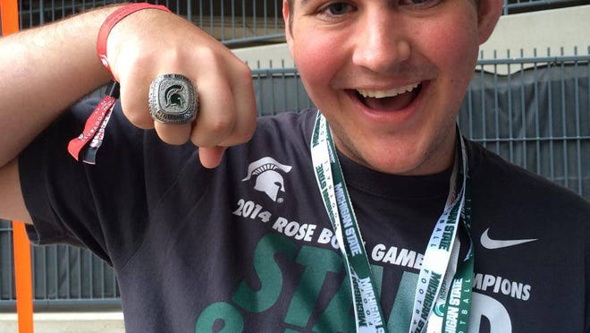 Ryan Smigiel shows off his replica MSU's Rose Bowl ring.