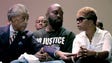 The Rev. Al Sharpton speaks with Michael Brown and Lesley McSpadden during a rally for their son Michael Brown at Greater Grace Church.