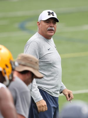 Michigan defensive coordinator Don Brown works with high school players during the Michigan Football Elite Camp on June 23, 2017, at Michigan Stadium.