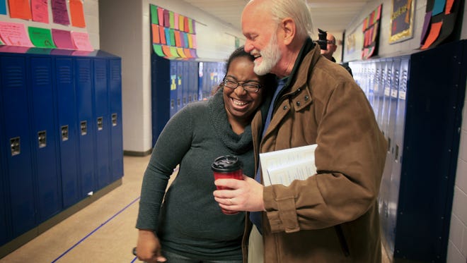 Robert Frost Sixth Grade Academy Principal Faith Stroud, left, hugs executive coach and author Marshall Goldsmith, right, at the school on Thursday.  Goldsmith, a graduate of JCPS schools, including Frost, met with school officials to see how he could collaborate and help motivate staff and students at the school.February 5, 2015