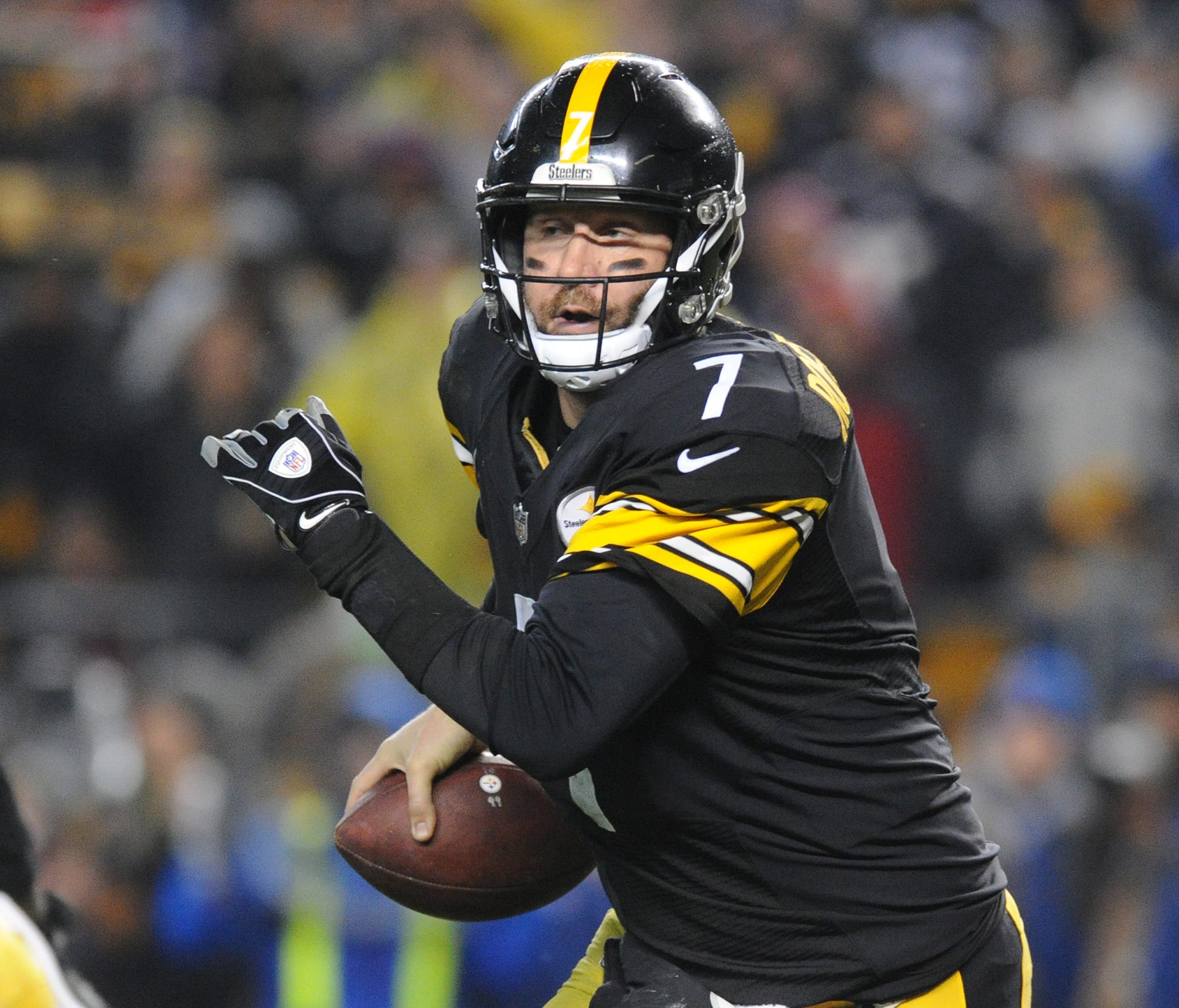 Pittsburgh Steelers quarterback Ben Roethlisberger (7) scrambles in the fourth quarter against the New England Patriots at Heinz Field.