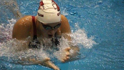 Canton senior Emily Hugan competes in the 200 medley relay during Friday’s preliminaries at Eastern Michigan University.