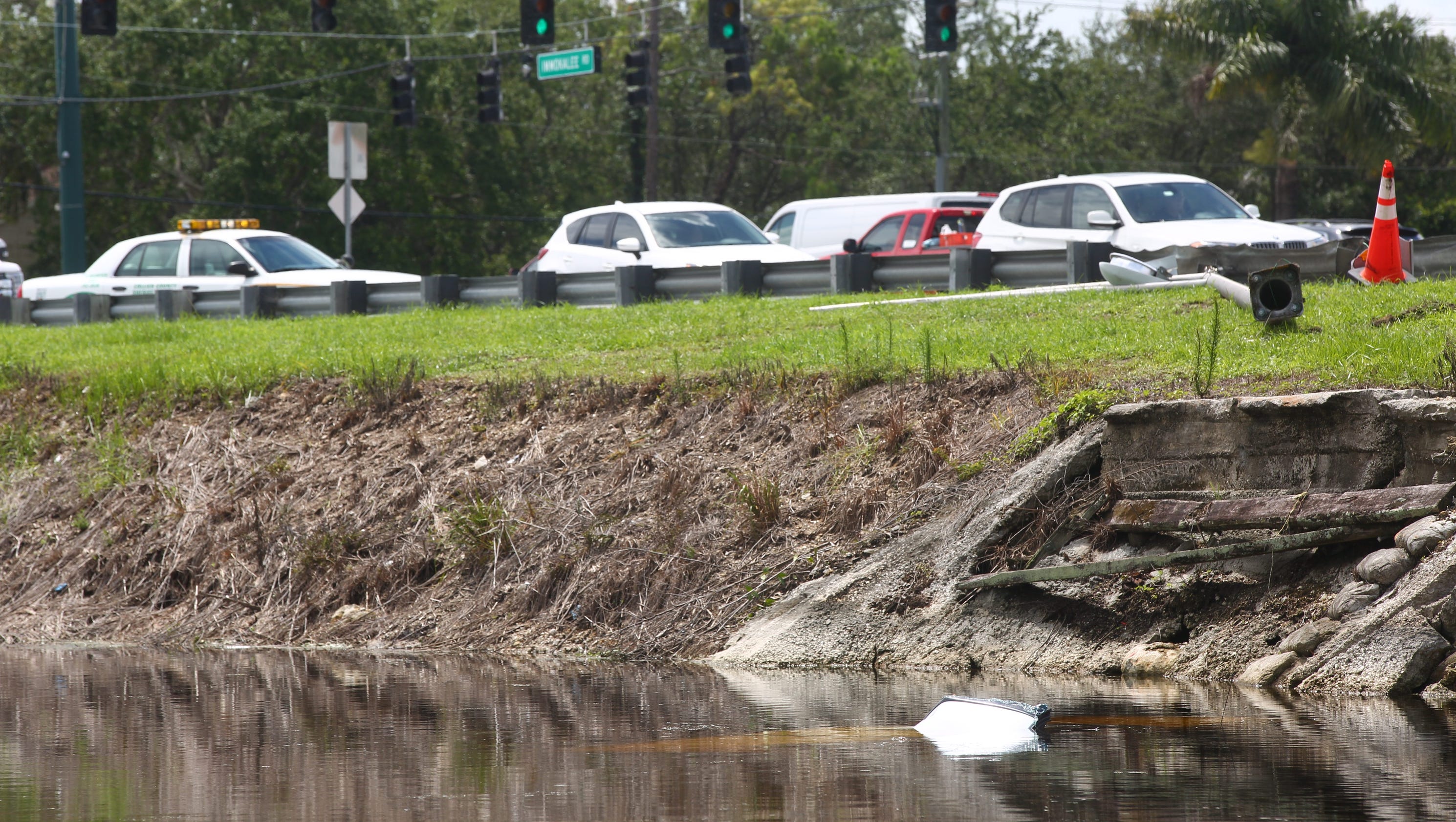 SUV slips into North Naples canal after crash; minor injuries reported - Naples Daily News