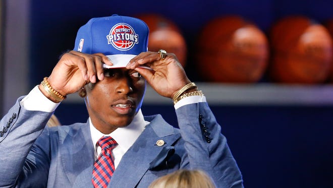 Stanley Johnson dons a Detroit Pistons cap after being selected eighth overall by the Pistons during the NBA draft June 25, 2015, in New York.