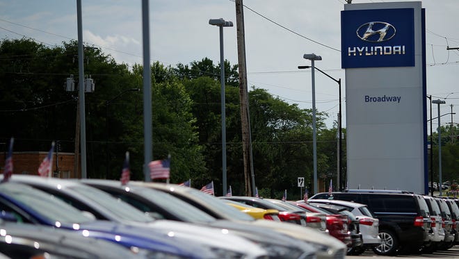 A row of Ford Escape vehicles sit on the lot at Broadway Ford Hyundai in Green Bay.