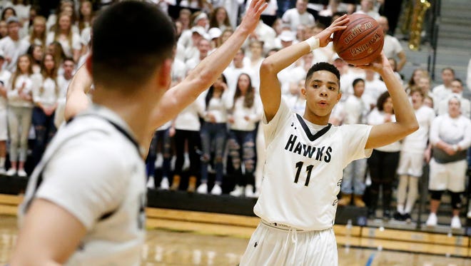 The Corning-Painted Post Hawks hosted the Horseheads Blue Raiders for the Section 4 Class AA boys basketball semifinals March 1. At halftime, the Hawks were leading 29-15.