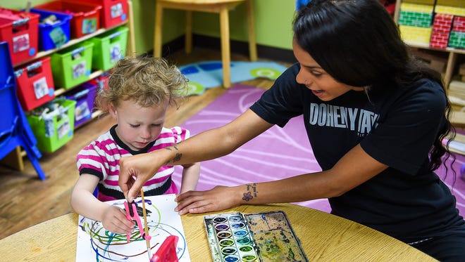 Shazia Sayeed, right, works with Brenna Pinney in the two-and-a-half to three-and-a-half year old class at Young People's Learning Center, Wednesday, June 10, 2015.