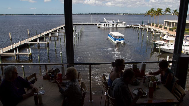 The Pure Fort Myers tour leaves the Marina at Edison Ford on Wednesday as diners eat and take in the view at Pinchers.