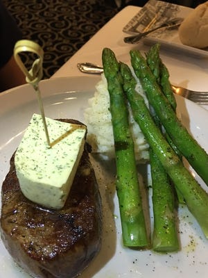 The center-cut prime filet mignon with white cheddar mashed potatoes and asparagus at Cafe Margaux was perfect, served with a fine-sized chunk of compound butter that overwhelmed nothing.