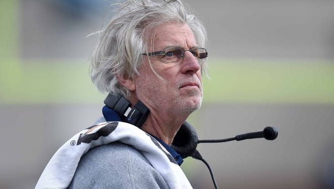 Jackson State white team coach Hal Mumme checks the clock on Sunday, April 15, 2018, at the JSU spring game in Mississippi Veterans Memorial Stadium in Jackson, Miss.