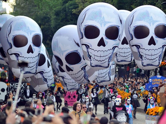 People take part in the Day of the Dead parade in Mexico