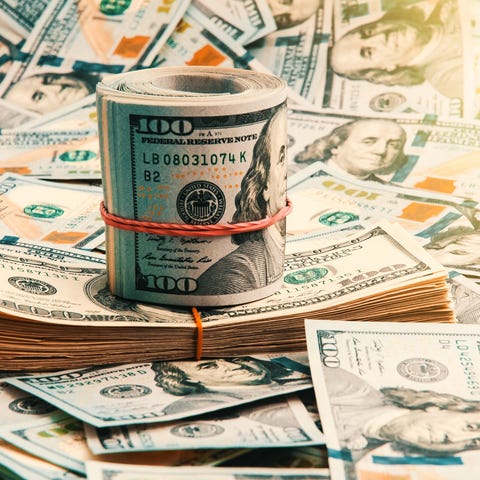 A roll on money on top of cash.