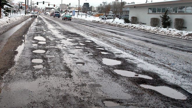 A file photo of Ryland Avenue from Locust Street riddled with potholes. Reno city officials say the recent winter weather and snow created potholes through the city.