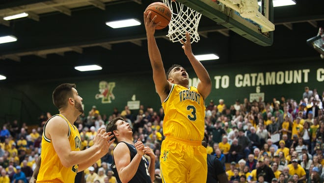Catamounts forward Anthony Lamb (3) leaps for a layup during the men's basketball game between the New Hampshire Wildcats and the Vermont Catamounts at Patrick Gym on Thursday night.
