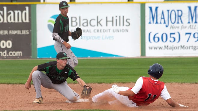 Sioux Falls West's Landon Badger slides to second base a second too late as Pierre Post 8's second baseman tags him out during the State Legion game on Wednesday at Fitzgerald Field in Rapid City. 