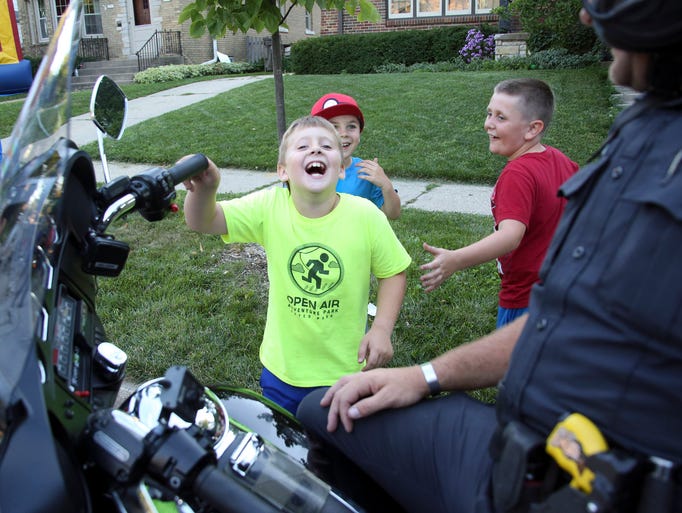 Neighbors Eli Zilinskas, 8, left, Pierce Wolters, 6,