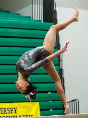 Bishop Ahr's Ariyana Agarwala competes on the beam in the NJSIAA Gymnastics state individual championship at Montgomery High School on Saturday Nov. 14, 2015. Photo by Jeff Granit
