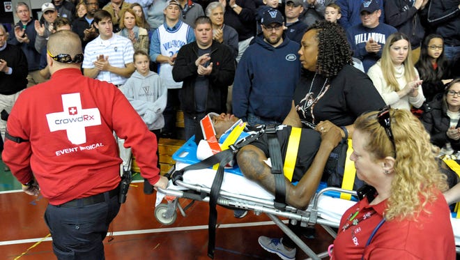 Xavier Musketeers guard Edmond Sumner is wheeled off the court on a stretcher.