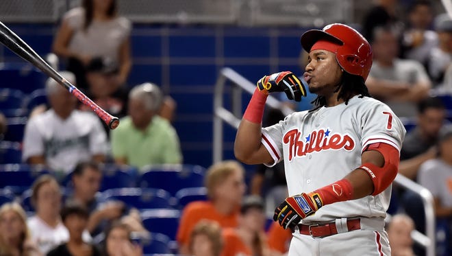 Philadelphia Phillies third baseman Maikel Franco tosses his base after struck out swinging in the fifth inning Aug. 31 against the Miami Marlins at Marlins Park.