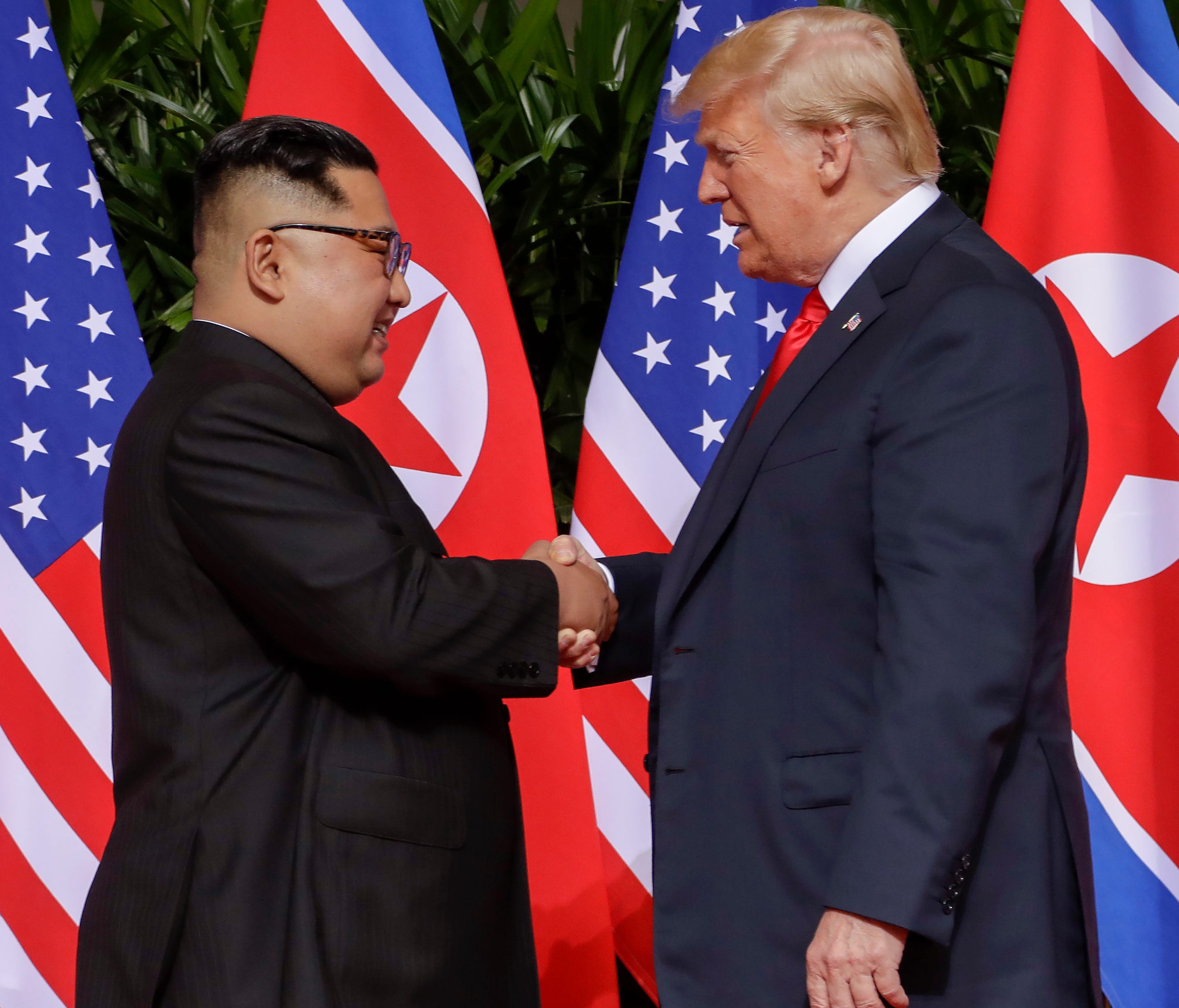 President Trump shakes hands with North Korea leader Kim Jong Un at the Capella resort on Sentosa Island in Singapore.