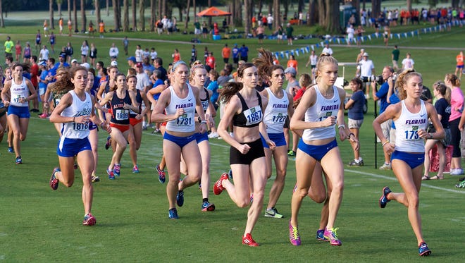 Courtesy Jim Burgess, UF Communications FGCU senior Kelly Perzanowski (1818), in lead group at left, ran with the lead pack from the start of the Mountain Dew Invitational on Sept. 14, on the University of Florida's Mark Bostick Golf Course in Gainesville and won the six-kilometer race in a personal-best time of 20 minutes, 45.06 seconds.