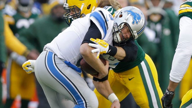 Lions quarterback Matthew Stafford is sacked by Clay Matthews in the final regular-season game of the Packers' 2014 season. Matthews had 11 sacks in the regular season.