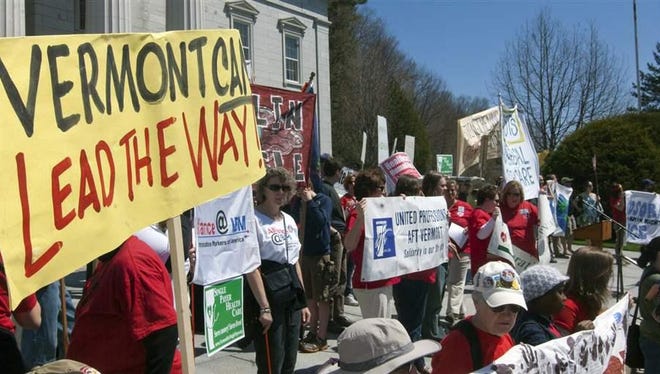 Vermonters rally at the State House in Montpelier in 2011 in support of universal, publicly financed health care. The state plans to launch its single-payer system in 2017. (AP)