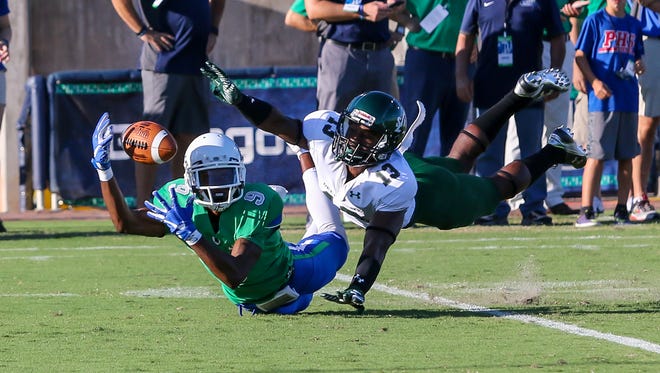 UWF's Ka'Ron Ashley (9) stretches out and tries to make the catch against Delta State defensive back Devontae Wilson (13) at Blue Wahoos Stadium on Saturday, October 14, 2017.