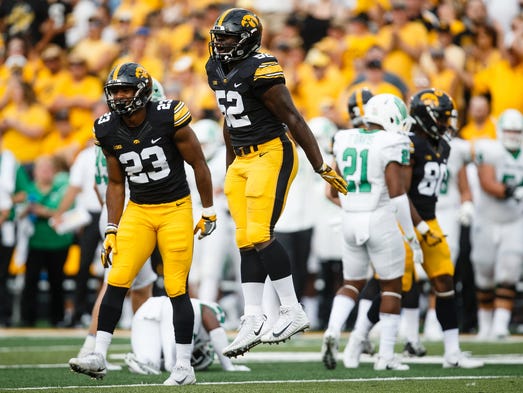 Iowa's Amani Jones (52) reacts to making a play during