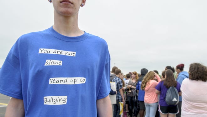 Southeast Polk students from the junior and senior high schools walked out of class to call attention to and protest bullying on Friday. Several students wore T-shirts and carried signs with anti-bullying messages.