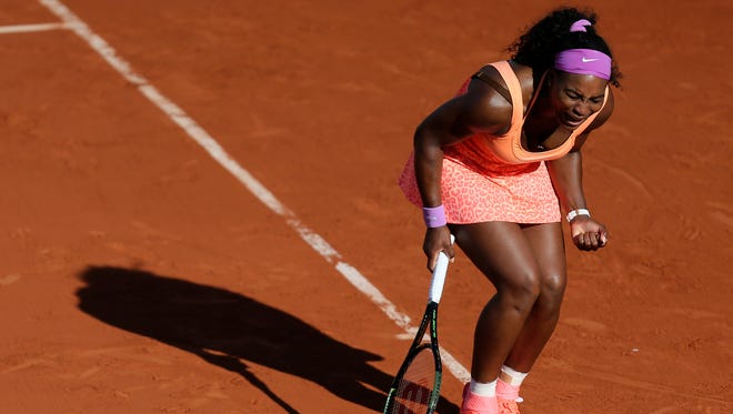 Serena Williams clenches her fist as she plays Timea Bacsinszky of Switzerland during their semifinal match of the French Open on June 4, 2015 in Paris.