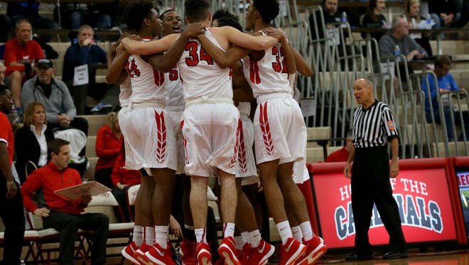 The Pike Red Devils get pumped before the game against New Albany during the Tip Off Classic on Dec. 12, 2015.