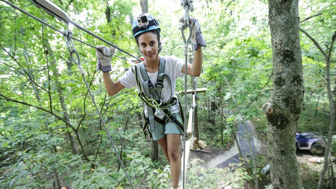 IndyStar reporter Alexa Goins tries out the nearly completed Koteewi Aerial Adventure Park & Tree Top Trails at Strawtown Koteewi Park in Noblesville.